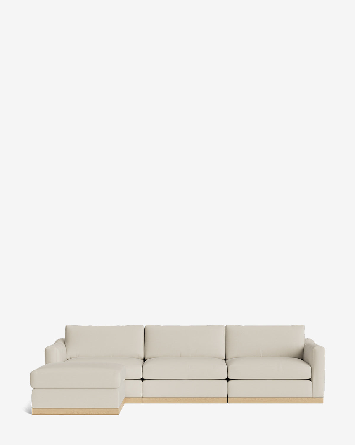 The Vernon Modular Sofa with Ottoman 121 is a modern, light beige fabric sofa with a wooden base and left-side chaise, shown against a plain white background by McGee & Co.