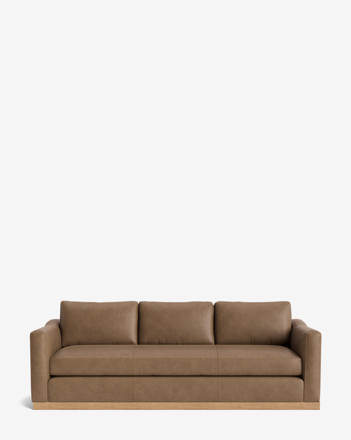 The Vernon Sofa 92 is a brown leather three-seater with an alder wood frame, three back cushions, and armrests on both sides, shown against a plain white background by McGee & Co.