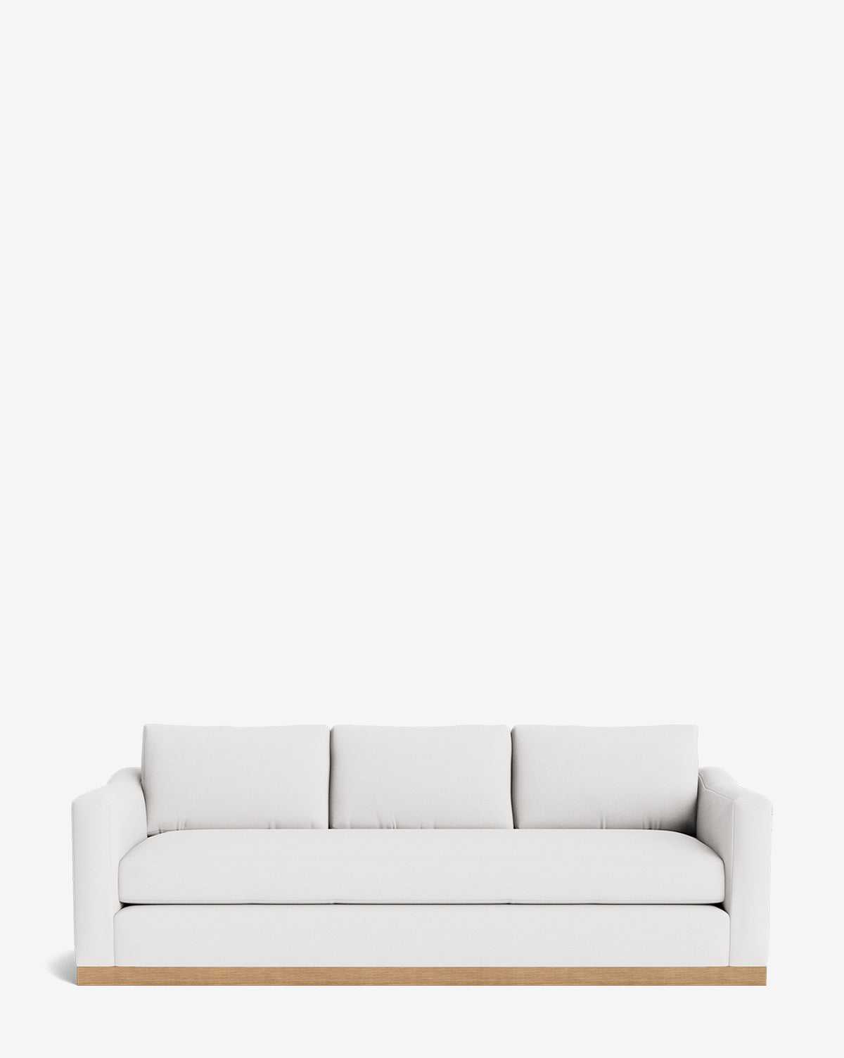 The Vernon Sofa 92 is a modern white velvet sofa with three seat cushions, three back pillows, low armrests, and a light alder wood frame, shown against a plain white background by McGee & Co.