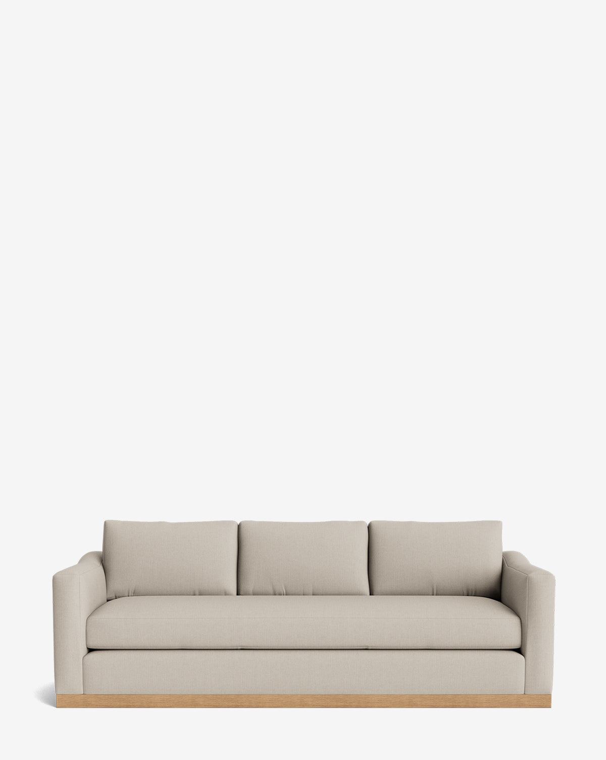 The Vernon Sofa 92 is a modern beige sofa with three seat cushions, three back pillows, low armrests, an alder wood frame, and a wooden base, shown against a plain white background by McGee & Co.