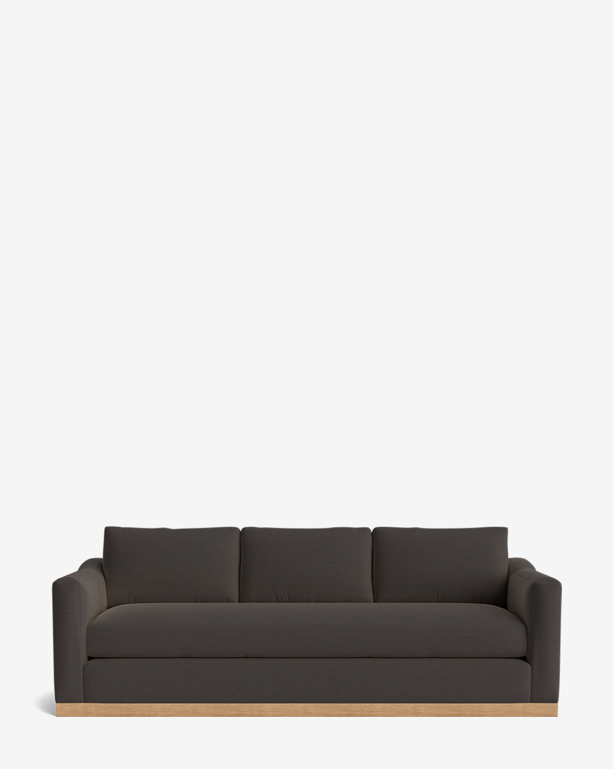 A modern dark gray Vernon Sofa 92 with low arms, three back cushions, and a light alder wood frame base, shown against a plain white background by McGee & Co.