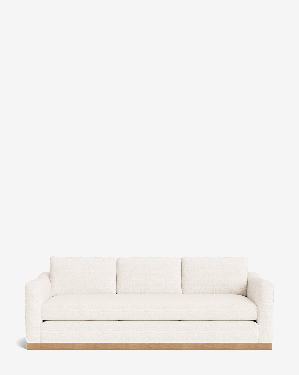 The Vernon Sofa 92 is a modern white velvet three-seater with plush cushions, wide armrests, and a light alder wood frame, shown against a plain white background by McGee & Co.