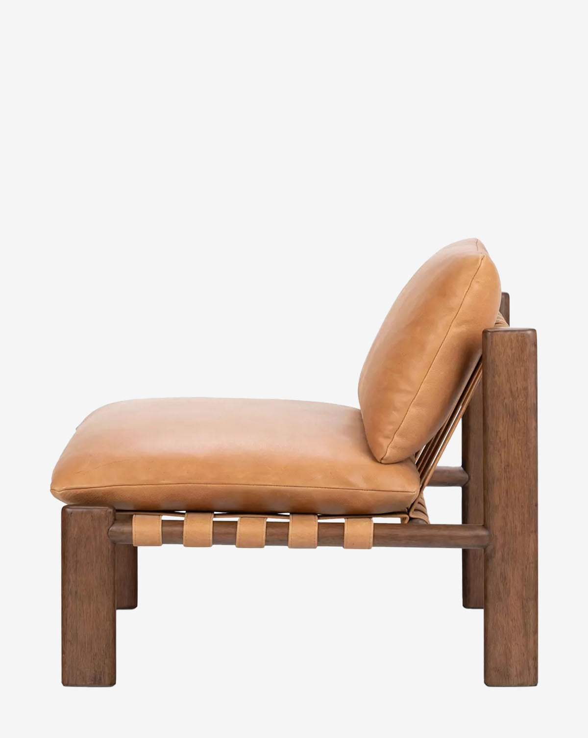 The Vevina Lounge Chair features a wooden frame, tan top grain leather cushions, and leather strap supports, shown from the side against a white background by McGee & Co.