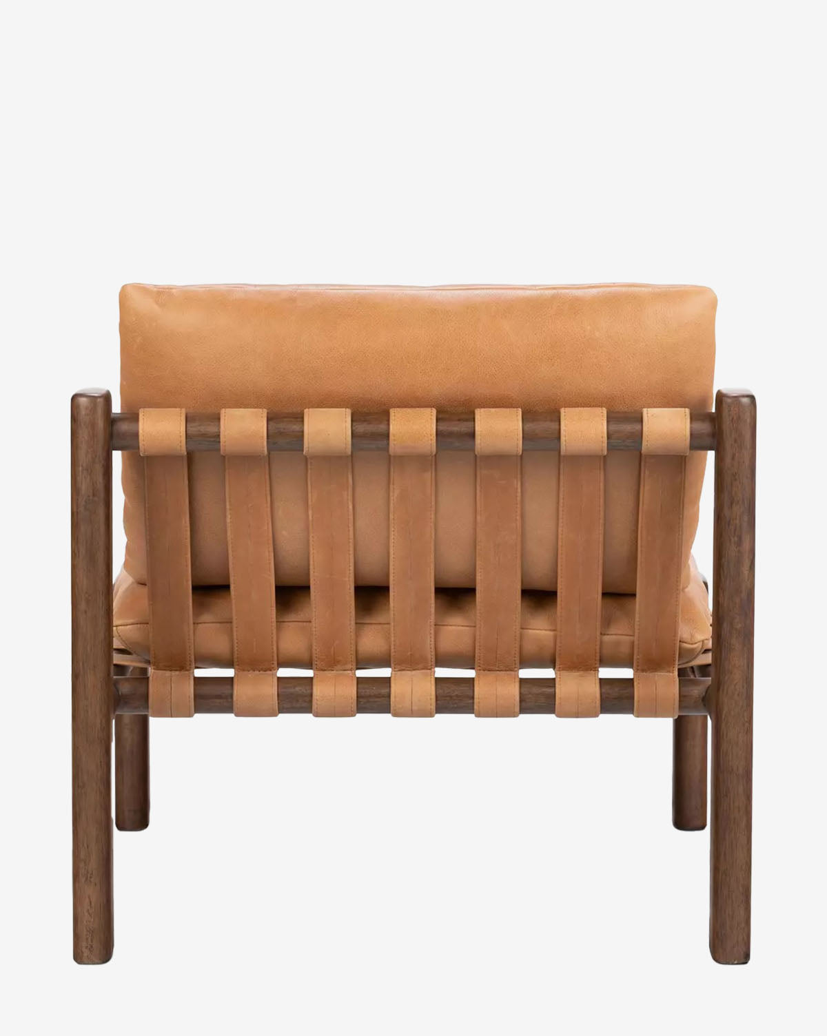 The Vevina Lounge Chair is shown from the back against a white background, featuring a wooden frame, wide top grain leather straps forming the backrest, and a tan leather cushion by McGee & Co.