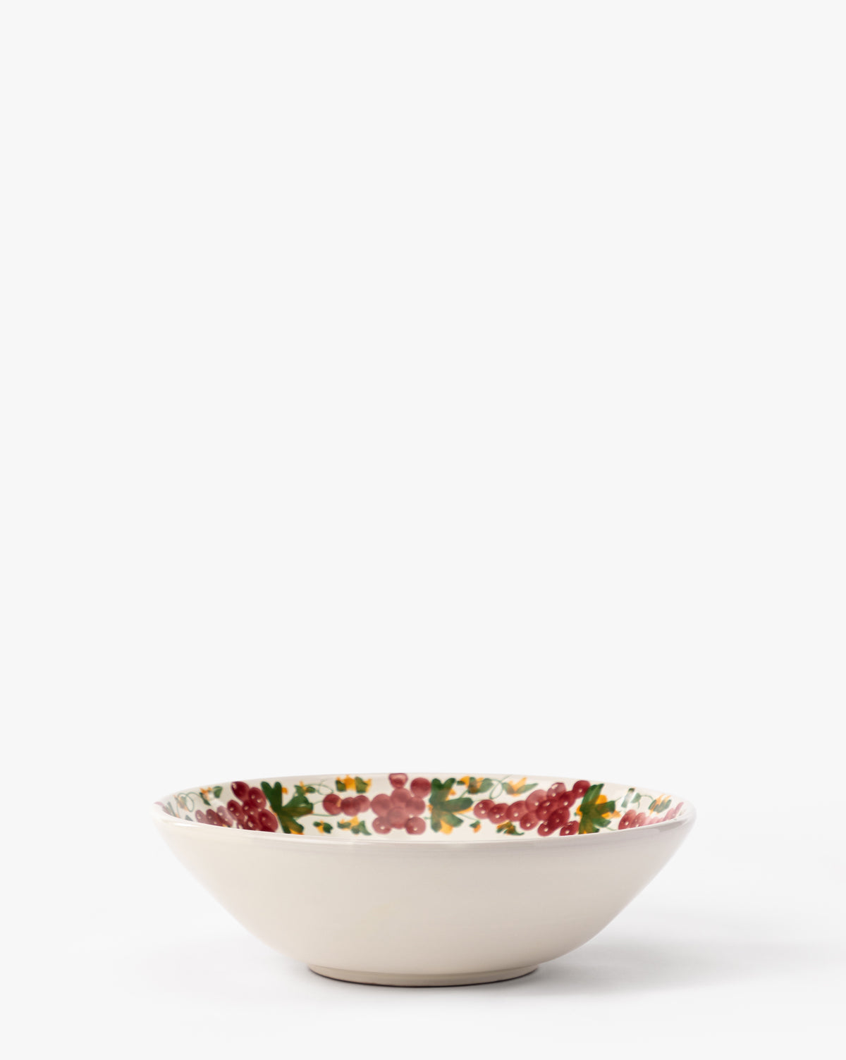 The Vine Large Bowl features a handmade ceramic design with a cream exterior and a vibrant grapevine motif on the inner rim, perfect for elevating any table setting, by McGee & Co. Shown against a plain white background.