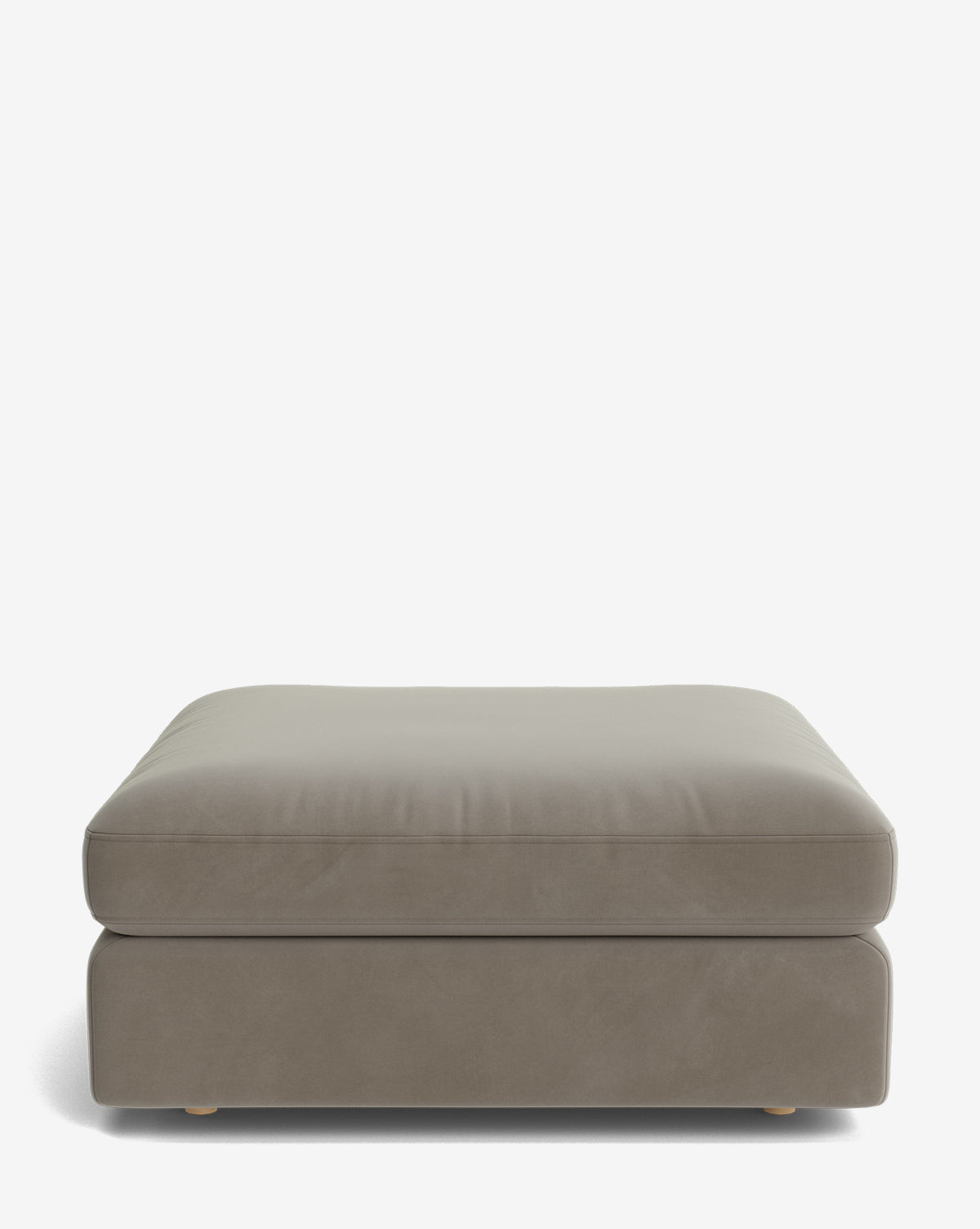 The Vivienne Modular Ottoman is a rectangular, light gray handmade piece featuring a plush cushion and low wooden feet, shown against a plain white background by McGee & Co.