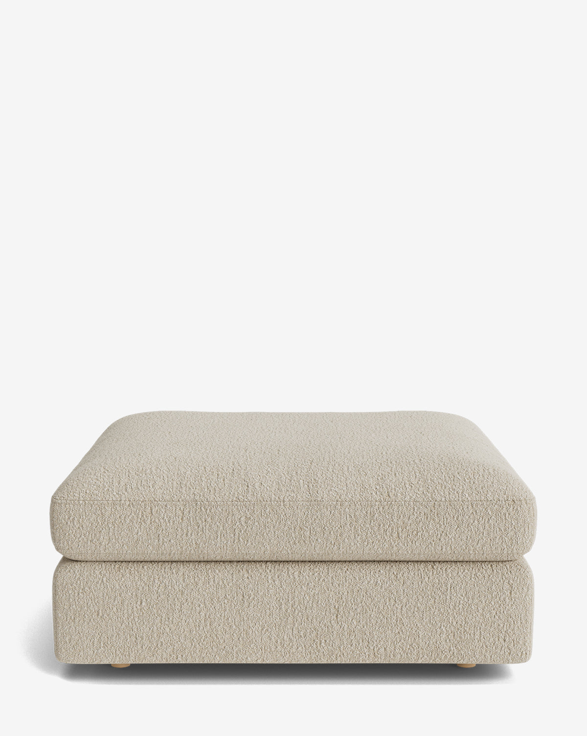 The Vivienne Modular Ottoman features a beige, rectangular handmade design with a textured fabric surface and minimalist style, shown against a plain white background by McGee & Co.