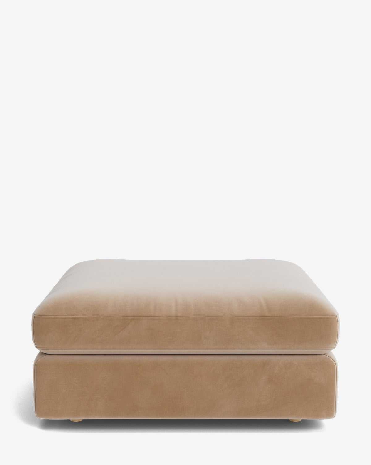 The Vivienne Modular Ottoman is a large, rectangular, tan piece with a plush cushioned top and modern design, shown against a plain white background by McGee & Co.