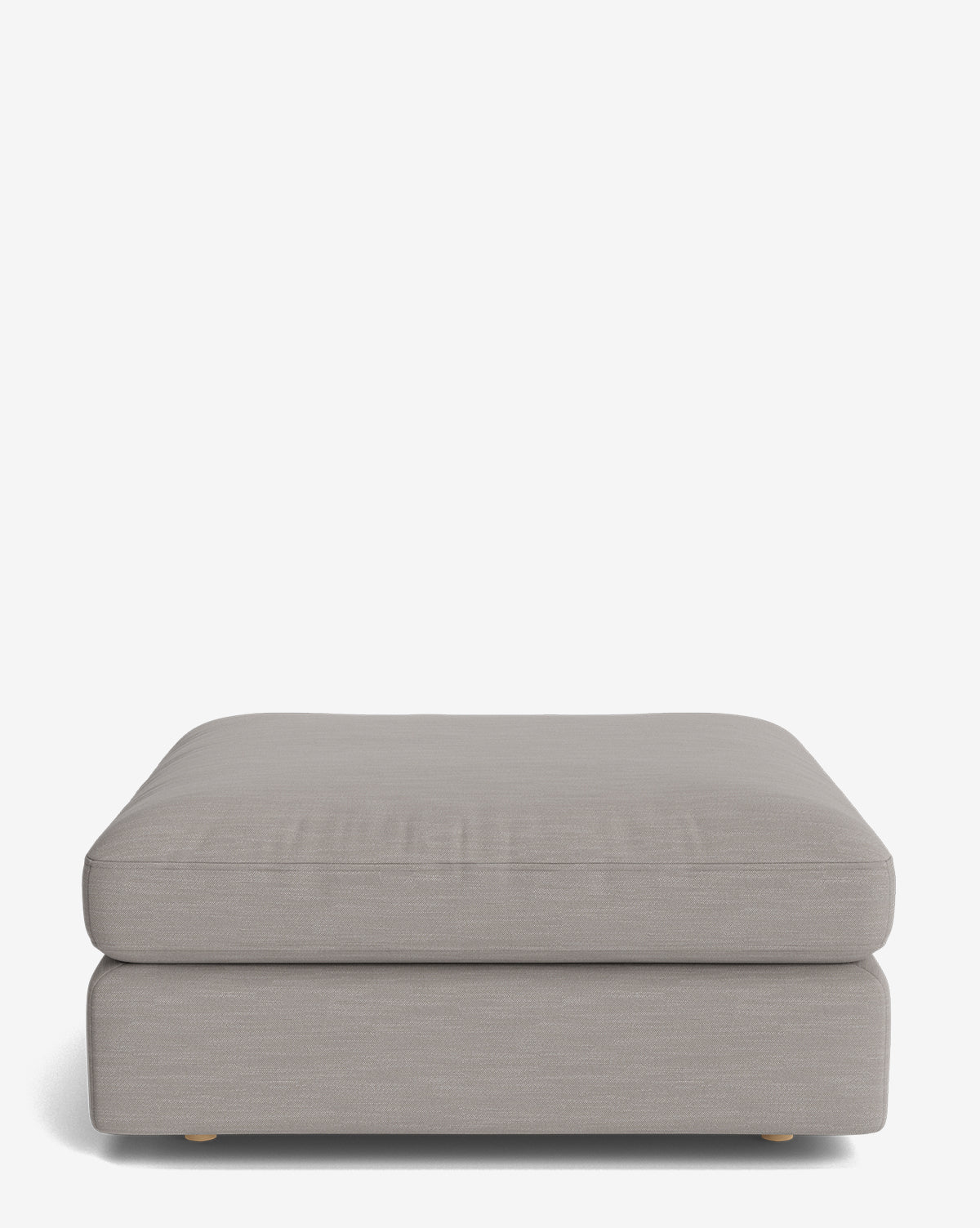 The Vivienne Modular Ottoman is a minimalist, rectangular piece featuring light gray upholstery and low, rounded wooden feet, displayed against a plain white background by McGee & Co.