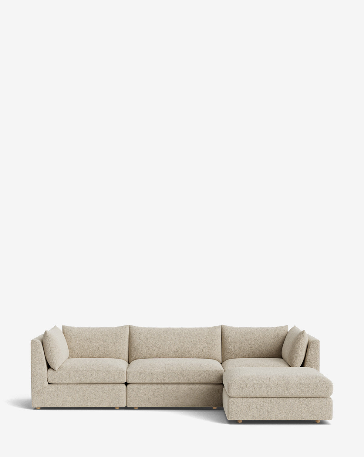 The Vivienne Modular Sofa with Ottoman features a modern, light beige design with three seat cushions on the left and a right-side chaise lounge, displayed against a plain white background by McGee & Co.