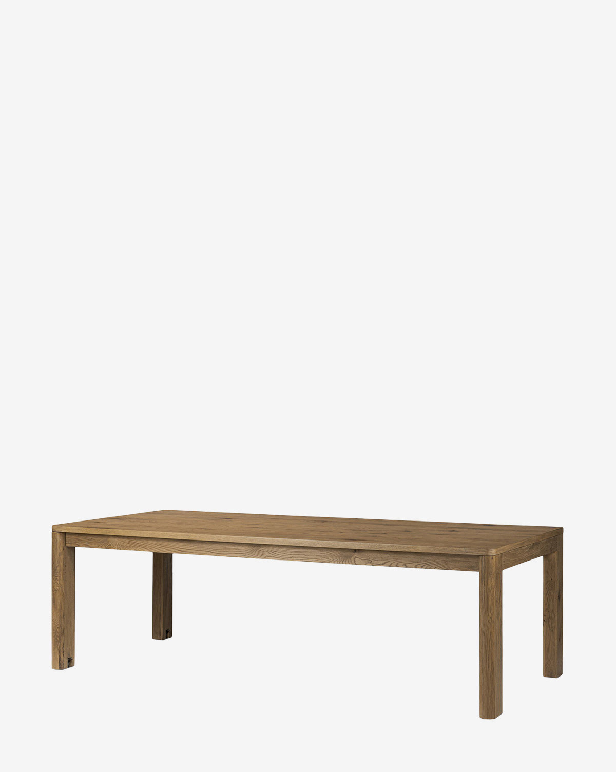 The Wagner Extension Dining Table is a rectangular oak table with sturdy construction and simple design, featuring four strong legs, shown against a plain white background by McGee & Co.