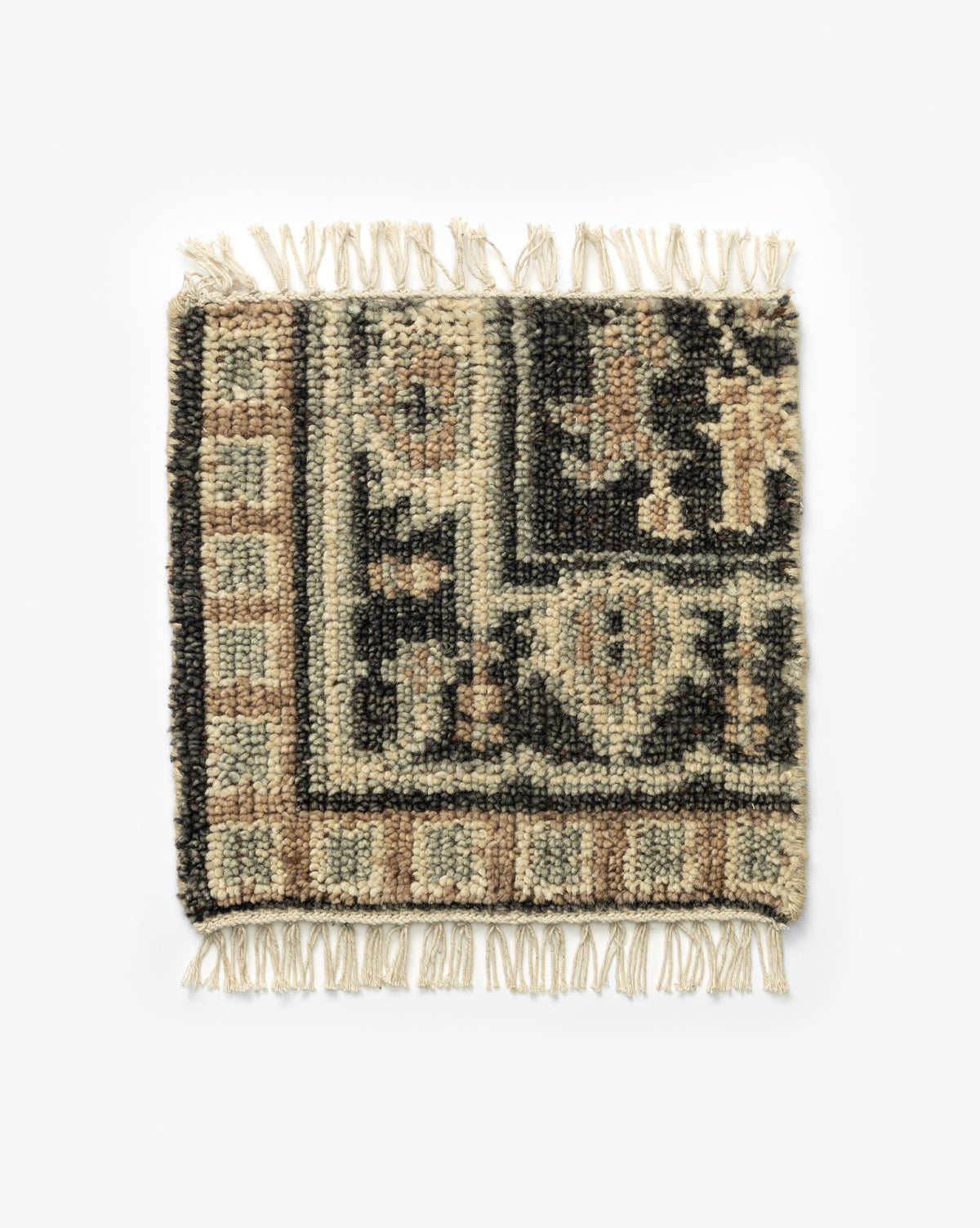 The Wayland Hand-Knotted Wool Rug Swatch displays a woven geometric traditional pattern in black, beige, and brown tones, featuring short fringe on two opposite edges by McGee & Co.