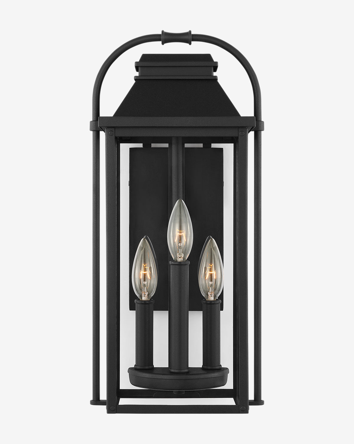 The Wellsworth Lantern is a black metal outdoor wall fixture featuring an aluminum and glass rectangular frame with three vertically arranged candelabra lights and a clear glass enclosure, offering a modern, elegant design inspired by the Wellsworth Pendant, by McGee & Co.