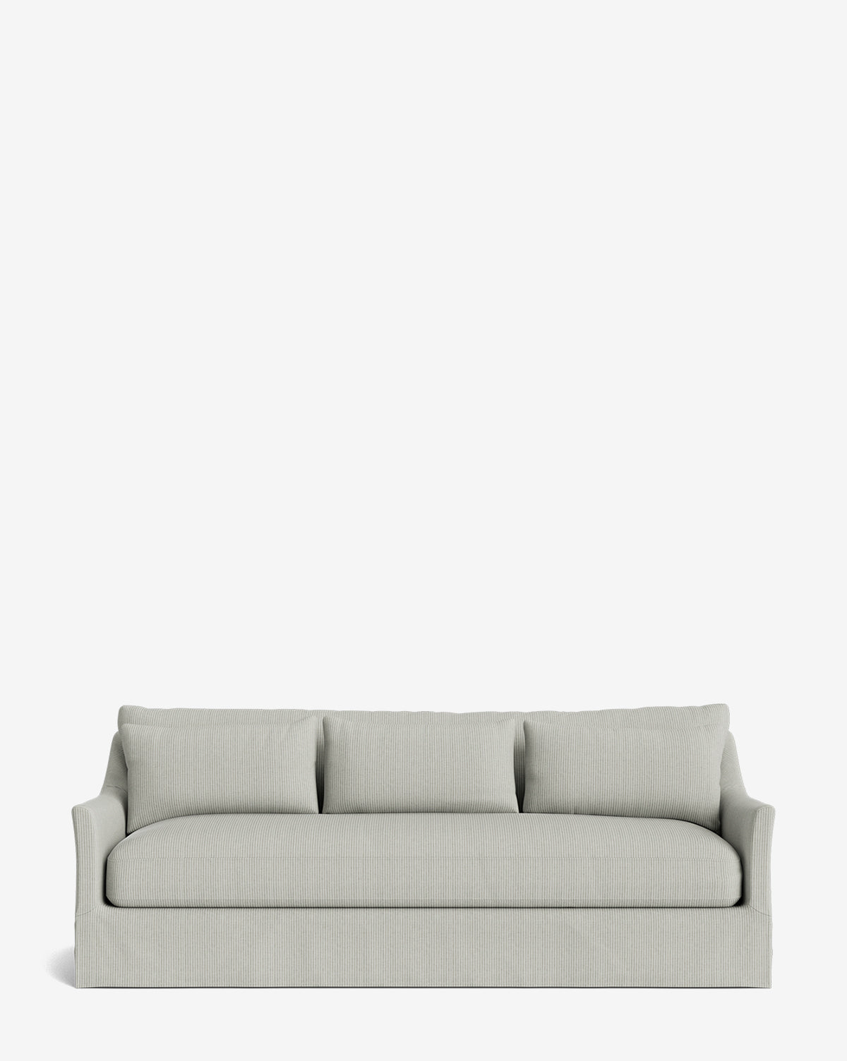 The Wilhelmina Classic Slipcover Sofa (85-110) features light gray upholstery, three cushions, slightly curved armrests, and a skirted base for a luxurious look against a plain white background, by McGee & Co.