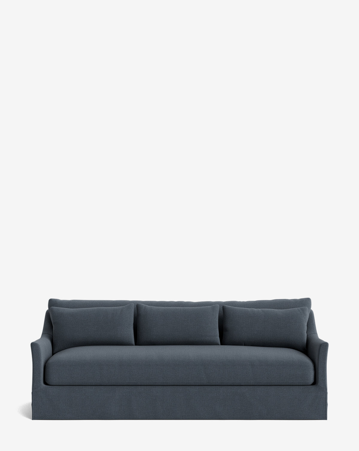 The Wilhelmina Deep Slipcover Sofa (85-110) is a luxurious dark blue three-seater with large back cushions and subtly curved armrests, set against a plain white background, by McGee & Co.