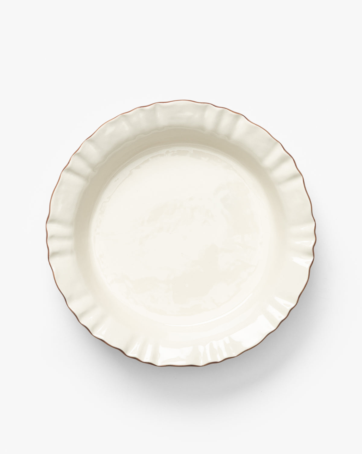 The Willow Pie Dish is a plain, round scalloped bakeware in a light cream shade, viewed from above on a white background—an ideal heirloom piece for timeless baking moments, by McGee & Co.