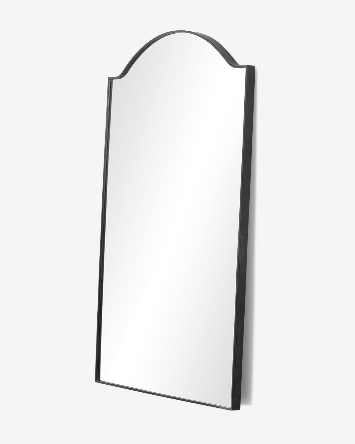 The Willson Floor Mirror features a large rectangular shape, an arched top, and a black gunmetal frame, shown against a plain white background by McGee & Co.