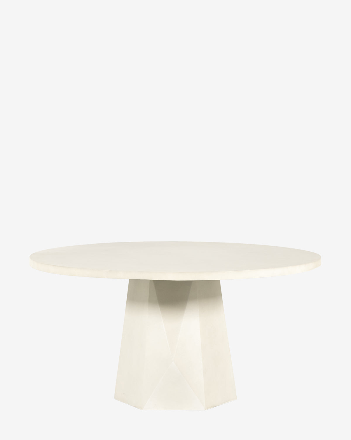 The Yale Outdoor Dining Table is a round, contemporary table with a flat top and a geometric, faceted pedestal base, shown against a plain white background by McGee & Co.