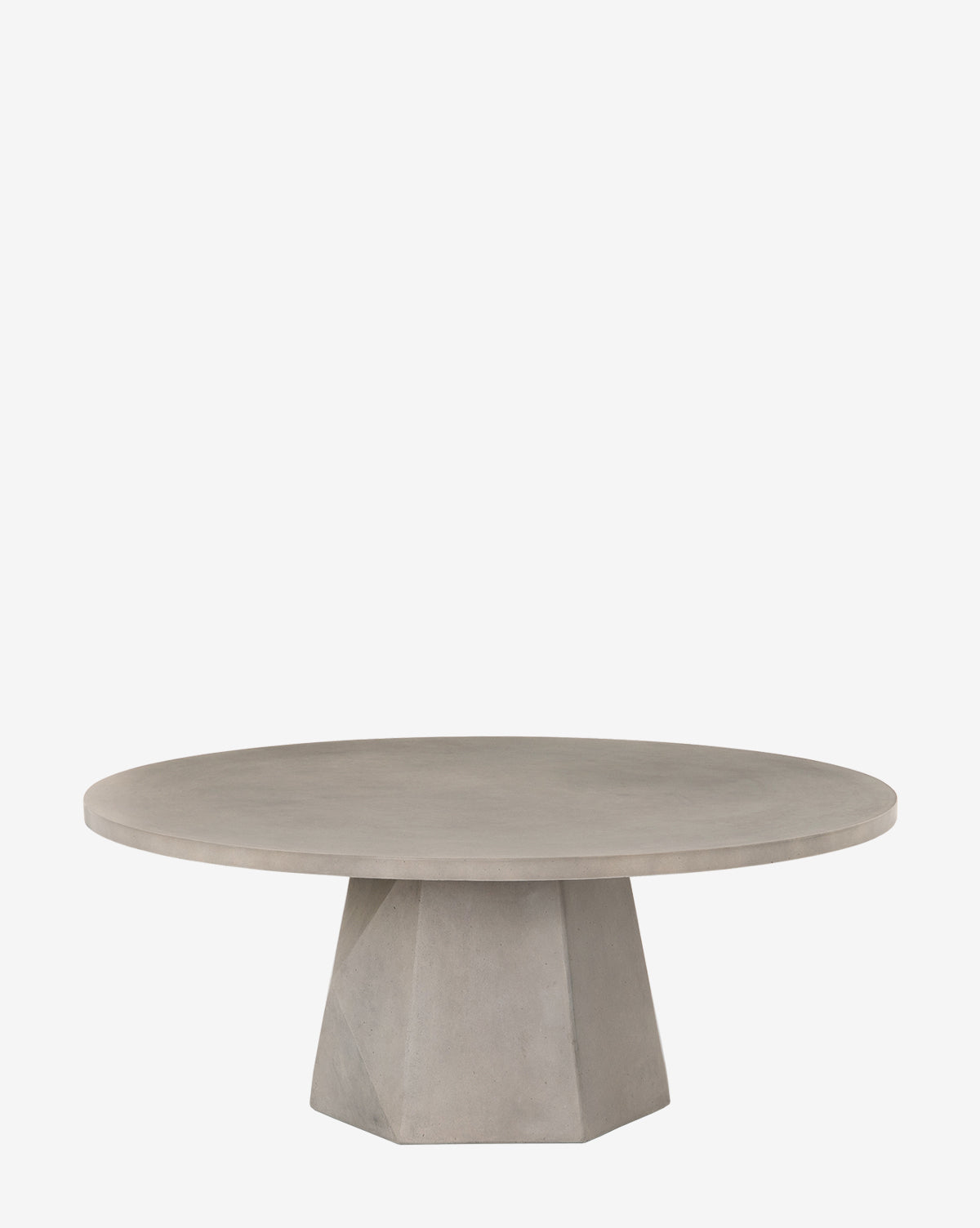 The Yale Outdoor Coffee Table features a round, light gray concrete design with a wide, flat top and geometric faceted pedestal base, shown against a plain white background by McGee & Co.