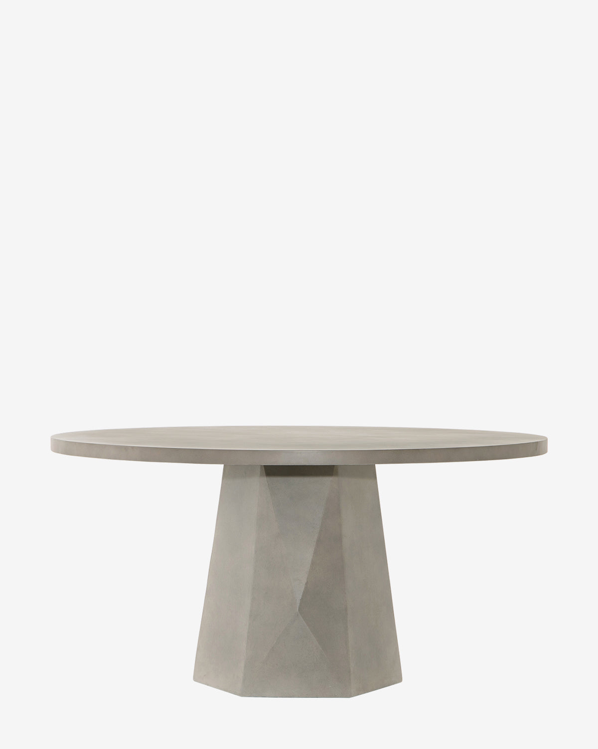 The Yale Outdoor Dining Table features a smooth, flat top and a faceted geometric pedestal base in light gray concrete, shown against a plain white background by McGee & Co.