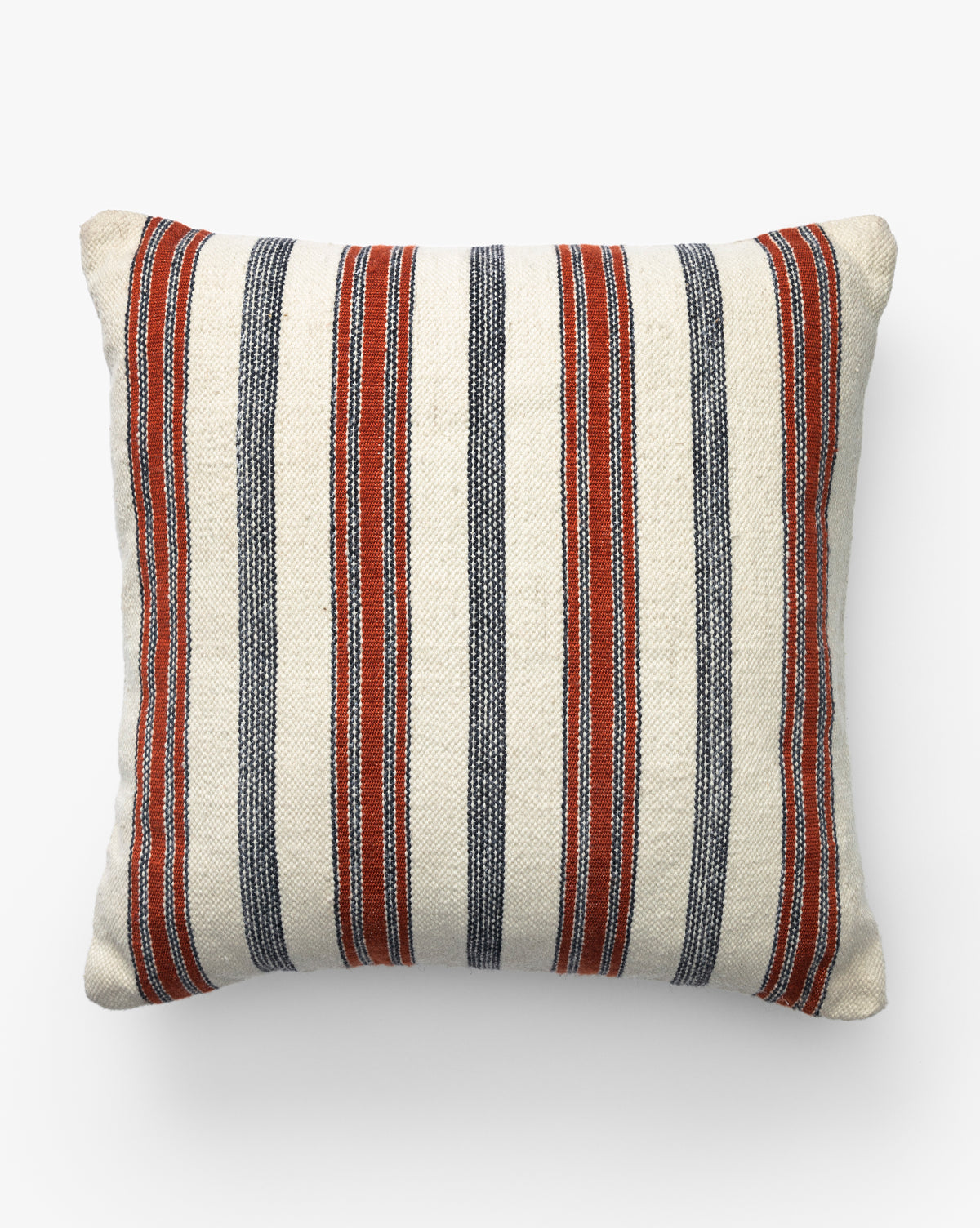 The Yardley Indoor/Outdoor Pillow is a square cushion with cream fabric and vertical red and navy stripes. Its simple, classic design adds a soft, plush accent to any space by McGee & Co.