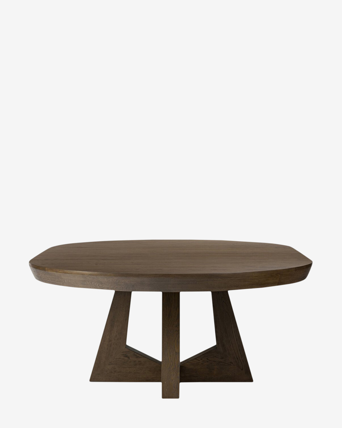 The Yvonne Dining Table features a modern round design with a thick top, geometric triangular base, elegant oak woodgrain, and rich dark finish, shown against a plain white background by McGee & Co.