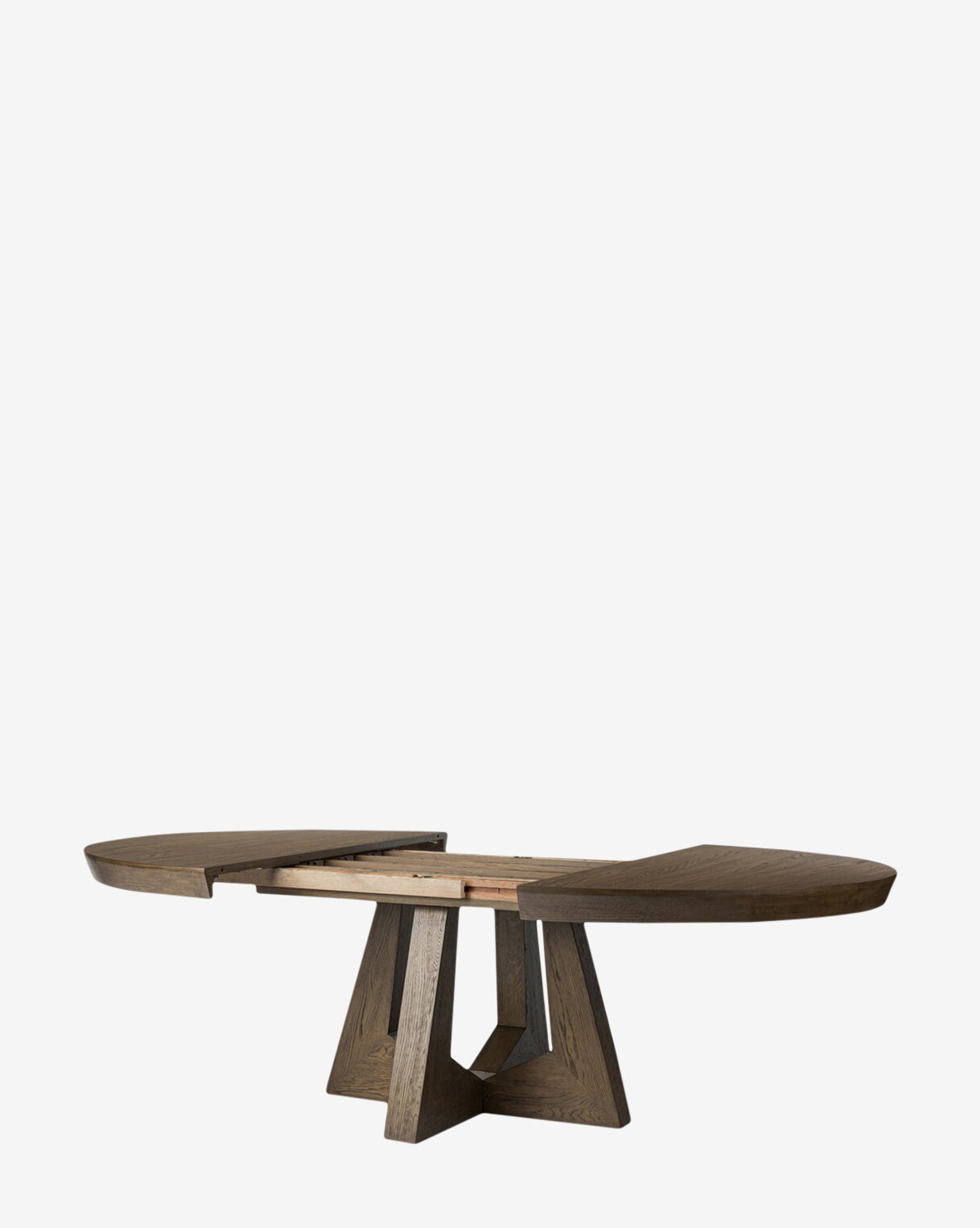 The Yvonne Dining Table features a modern oak woodgrain finish and a geometric pedestal base, shown partially extended with its two ends separated to display the extension mechanism by McGee & Co.