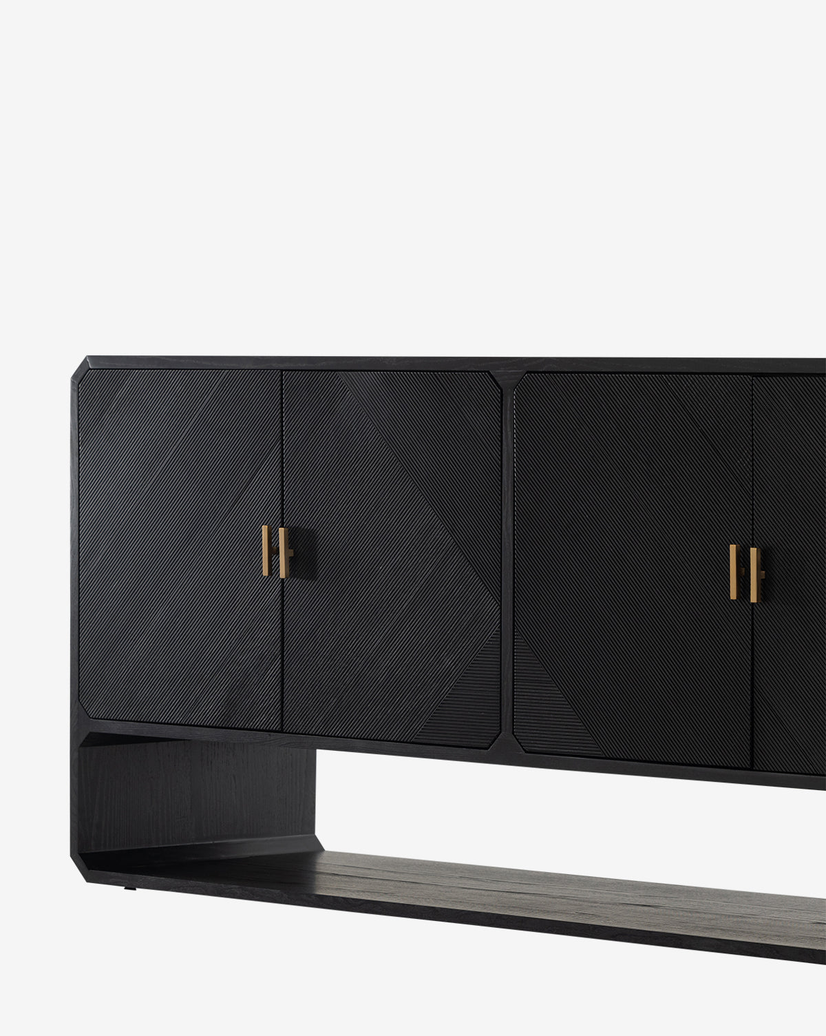 The Ziggy Sideboard, crafted in black ash veneer, features geometric textured doors with gold handles and a rectangular open base, displayed against a plain white background by McGee & Co.