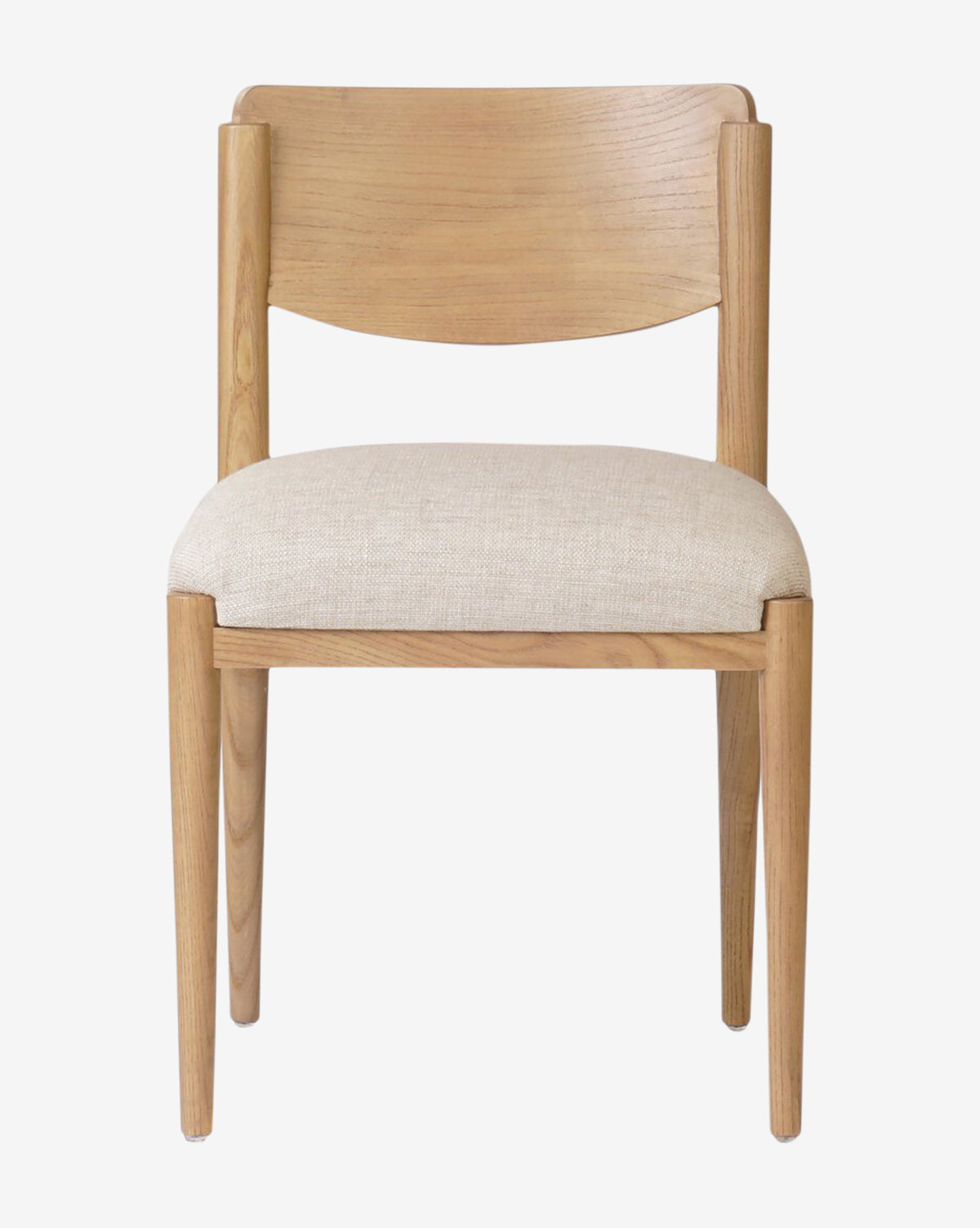 The Reverie Dining Chair features a curved backrest, wood frame, light beige upholstered seat cushion, clean lines, and a natural wood finish, by McGee & Co.